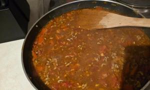 Beef stock, chopped tomatoes, tomato puree, marjoram, sugar, salt and pepper added, bit too much water me thinks...